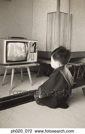 Boy watching television program View Large Photo Image Stock Image - Boy watching television program. Fotosearch