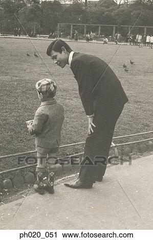 Father and son at the park View Large Photo Image Stock Image - Father and son at the park. Fotosearch