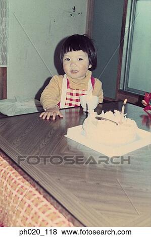 Girl and a birthday cake View Large Photo Image Stock Photo - Girl and a birthday cake. Fotosearch