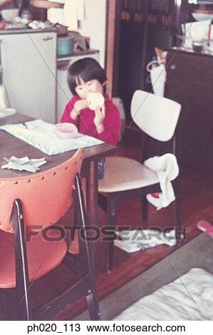 Girl eating snack at kitchen View Large Photo Image Stock Image - Girl eating snack at kitchen. Fotosearch