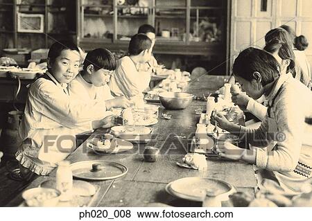 Stock Photo - Group of children eating lunch. Fotosearch