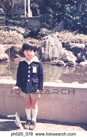 Stock Photo - Portrait of a boy at the park. Fotosearch