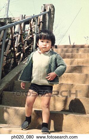 Stock Image - Portrait of a boy at the stairs. Fotosearch