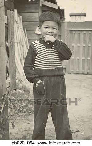 Portrait of a boy in backyard View Large Photo Image Picture - Portrait of a boy in backyard. Fotosearch