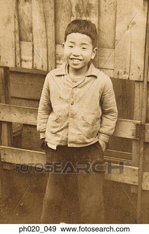 Portrait of a boy in backyard View Large Photo Image Stock Photo - Portrait of a boy in backyard. Fotosearch