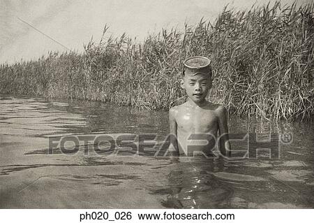 Portrait of a boy in river View Large Photo Image Stock Photograph - Portrait of a boy in river. Fotosearch