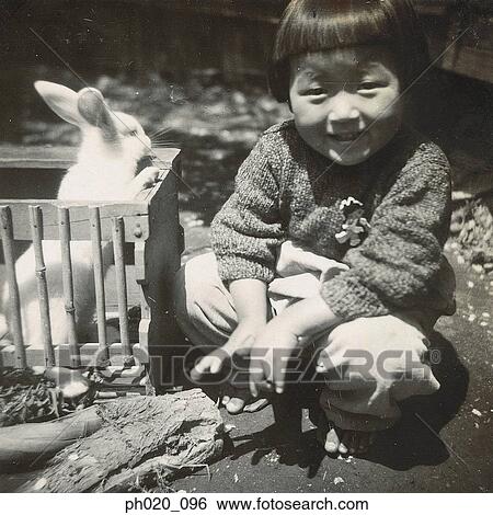 Portrait of a girl and rabbit View Large Photo Image Stock Photograph - Portrait of a girl and rabbit. Fotosearch