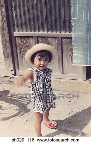 Stock Photograph - Portrait of a girl at passage way. Fotosearch