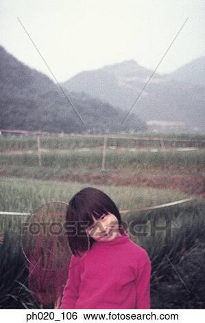 Portrait of a girl at vegetation View Large Photo Image Stock Photograph - Portrait of a girl at vegetation. Fotosearch