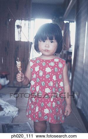 Portrait of a girl eating snack View Large Photo Image Stock Image - Portrait of a girl eating snack. Fotosearch