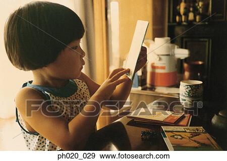 Portrait of a girl reading books View Large Photo Image Stock Photo - Portrait of a girl reading books. Fotosearch