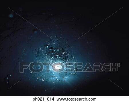 Picture - Bubbles rising through water, underwater view. Fotosearch