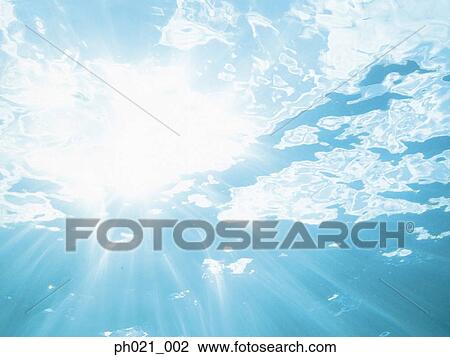 Sunlight filtering through water surface View Large Photo Image Stock Image - Sunlight filtering through water surface . Fotosearch