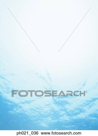 Sunlight filtering through water surface View Large Photo Image Stock Photograph - Sunlight filtering through water surface . Fotosearch