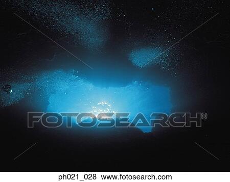 Sunlight shining through cave opening View Large Photo Image Stock Photo - Sunlight shining through cave opening. Fotosearch