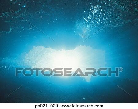 Sunlight shining through cave opening View Large Photo Image Stock Photo - Sunlight shining through cave opening. Fotosearch