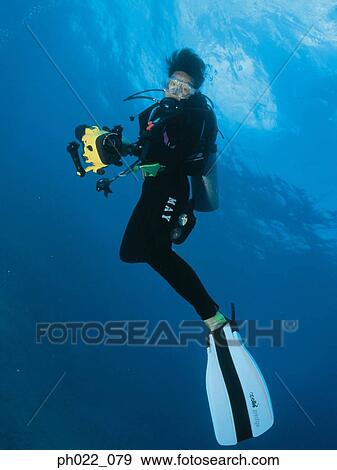Scuba diver underwater, portrait View Large Photo Image Stock Photo - Scuba diver underwater, portrait. Fotosearch