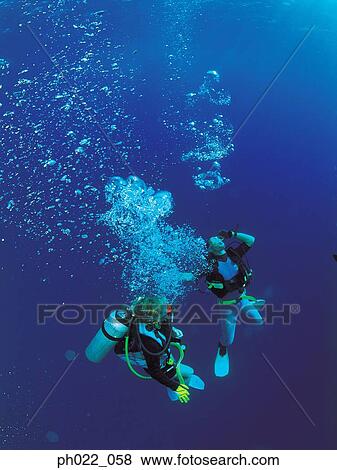 Scuba divers underwater View Large Photo Image Stock Photo - Scuba divers underwater. Fotosearch