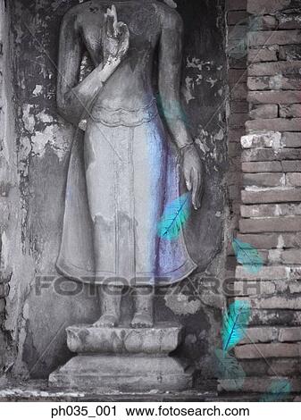 Statue engraved on concrete wall and fallen leaves View Large Photo Image Stock Image - Statue engraved on concrete wall and fallen leaves. Fotosearch