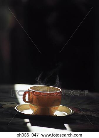 A cup of steaming hot beverage View Large Photo Image Stock Photo - A cup of steaming hot beverage. Fotosearch