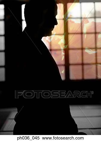Stock Photography - Silhouetted human figure. Fotosearch