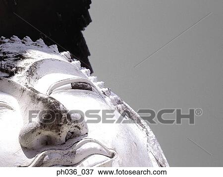 Stock Photo - Statue of Buddha's head. Fotosearch
