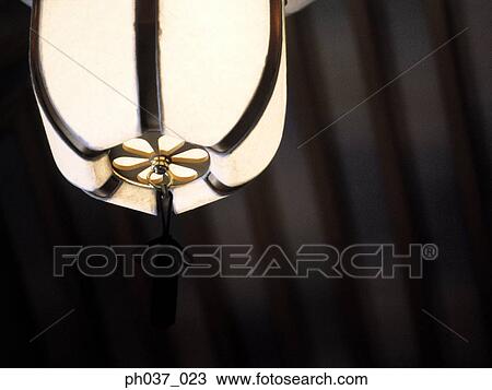 A hanging and lighted lantern View Large Photo Image Stock Image - A hanging and lighted lantern. Fotosearch