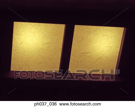 A pair of lighted window View Large Photo Image Stock Photograph - A pair of lighted window. Fotosearch