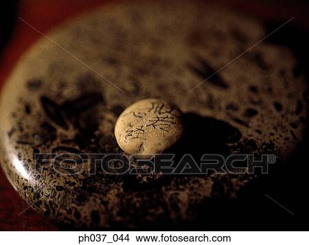 A round marble and a small marble with engraved Japanese script View Large Photo Image Picture - A round marble and a small marble with engraved Japanese script. Fotosearch