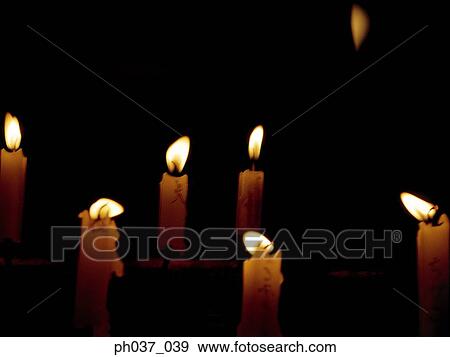 Lighted candles in the dark View Large Photo Image Stock Photo - Lighted candles in the dark. Fotosearch