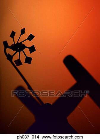 Silhouetted toy wind mill View Large Photo Image Picture - Silhouetted toy wind mill . Fotosearch