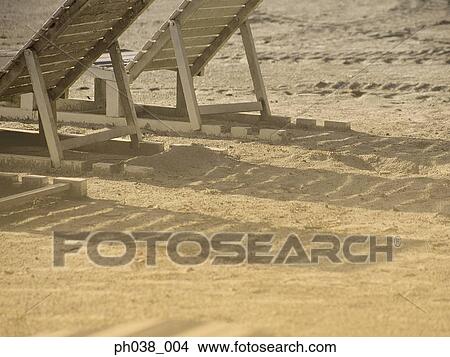 Picture -  Adirondack Chair on beach. Fotosearch