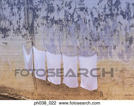 Fabrics hanging on old and ruined wall View Large Photo Image Stock Image - Fabrics hanging on old and ruined wall. Fotosearch
