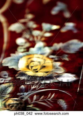 Stock Image - Flower embroidery on fabric. Fotosearch