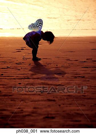 Stock Image - Girl in bending position with a pair of wings. Fotosearch