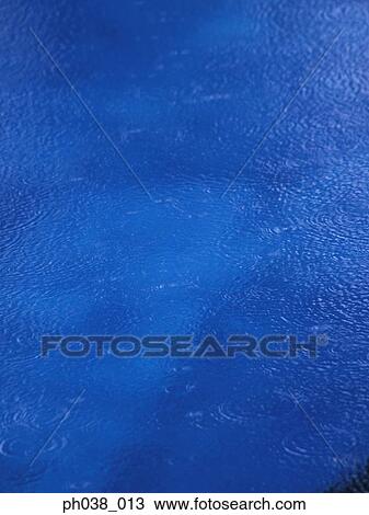 Stock Image - Surface of water and ripples. Fotosearch