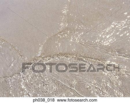 Stock Photo - Water reflection of sunlight. Fotosearch