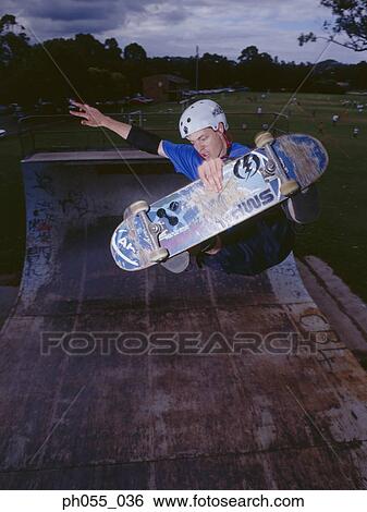 Stock Photograph - Man skateboarding on ramp . Fotosearch