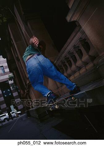 Rear view of skateboarder View Large Photo Image Stock Image - Rear view of skateboarder. Fotosearch