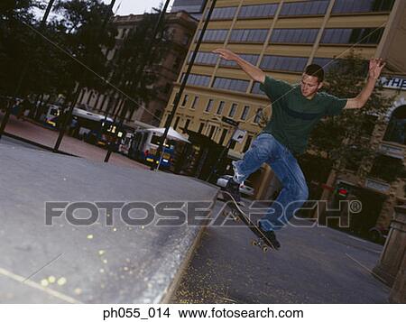 Picture - Skateboarder in mid-air . Fotosearch
