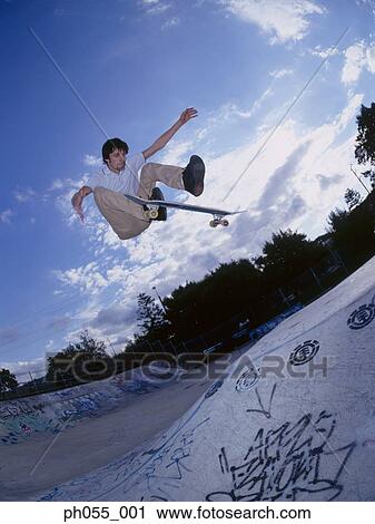 Skateboarder in mid air View Large Photo Image Stock Image - Skateboarder in mid air. Fotosearch