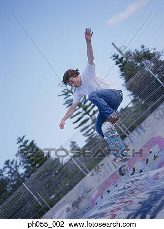 Stock Image - Skateboarder in mid air. Fotosearch