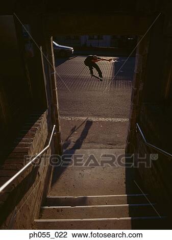 Stock Image - Skateboarder in mid-air . Fotosearch