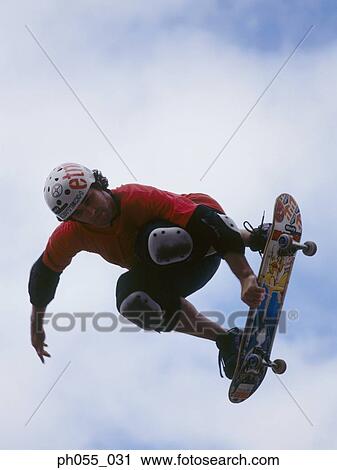 Skateboarder in mid air View Large Photo Image Stock Image - Skateboarder in mid air. Fotosearch