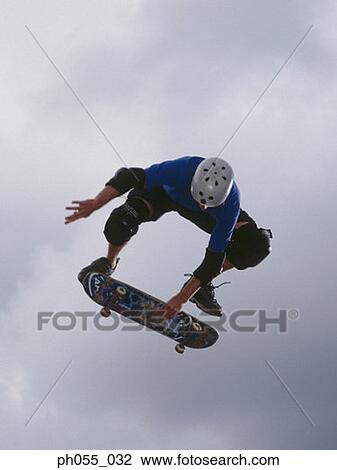 Stock Image - Skateboarder in mid air. Fotosearch