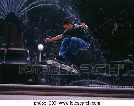 Stock Photo - Skateboarder in mid air. Fotosearch
