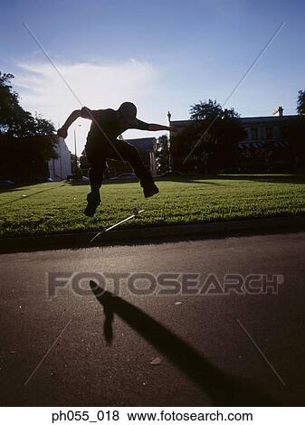 Skateboarder in mid air View Large Photo Image Stock Photo - Skateboarder in mid air. Fotosearch