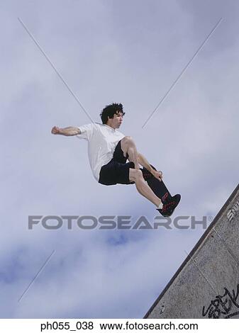 Stock Photo - Skateboarder in mid air. Fotosearch