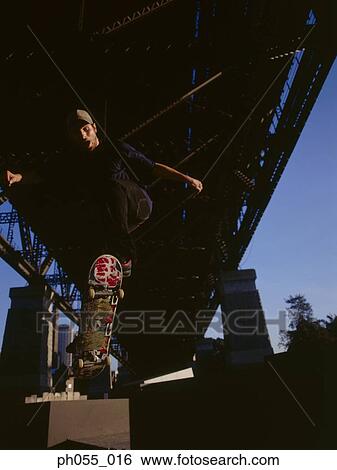 Skateboarder in mid-air View Large Photo Image Stock Photograph - Skateboarder in mid-air . Fotosearch
