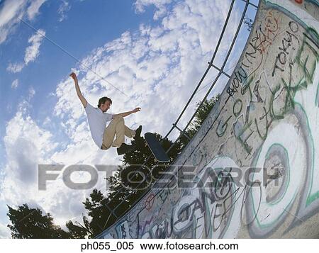 Skateboarder in mid air View Large Photo Image Stock Photography - Skateboarder in mid air. Fotosearch